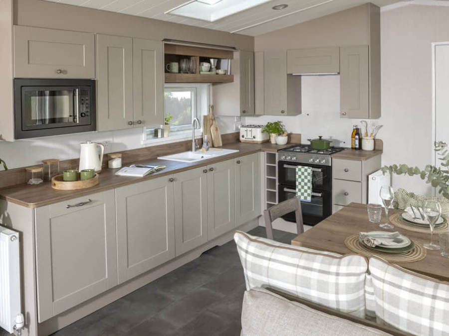 Picture of the kitchen area in an Swift Morlaix 40 x 14 2 bedroom Static Caravan Holiday Home sited at the Orchard Holiday Park, Wells next the Sea, North Norfolk.