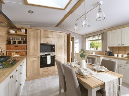 Picture of the dining area in an ABI Ambleside 40 x 14 2 bedroom Static Caravan Holiday Home sited at the Orchard Holiday Park, Wells next the Sea, North Norfolk.