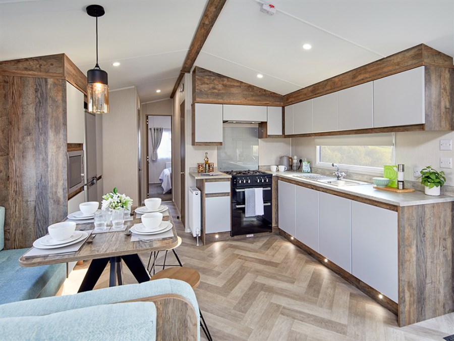 Picture of the kitchen and dining area in a Willerby Brookwood 38 x 12 2 bedroom Static Holiday Caravan sited on Orchard Holiday Park, Wells next the Sea, North Norfolk.