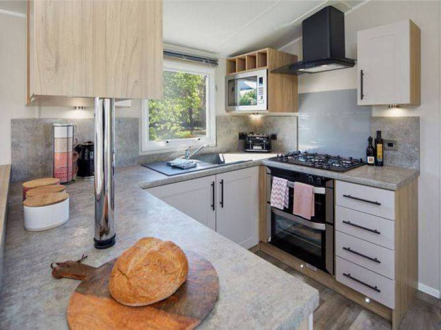 Picture of the kitchen in a Willerby Manor 38 x 12 2 bedroom Static Caravan Holiday Home, sited at The Orchard Holiday Park, Wells next the Sea, North Norfolk.